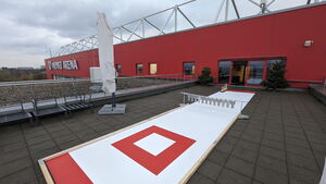 Eine mobile Eisstockbahn auf Dachterrasse der MEWA Arena des Mainz 05 für ein Teamevent/Betriebsausflug/Teambuilding Eisstockschießen von bo events.